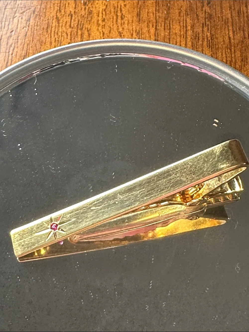 Vintage Anson Gold-Tone Star Accent Tie Clip with Red Stone